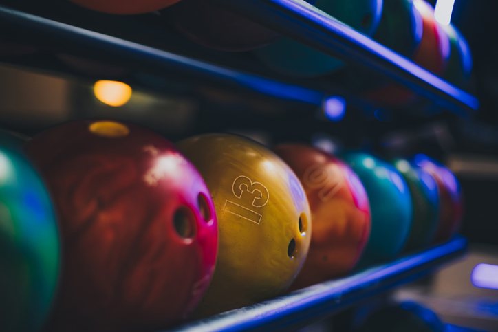 Rack of colorful bowling balls at Tiki Lanes